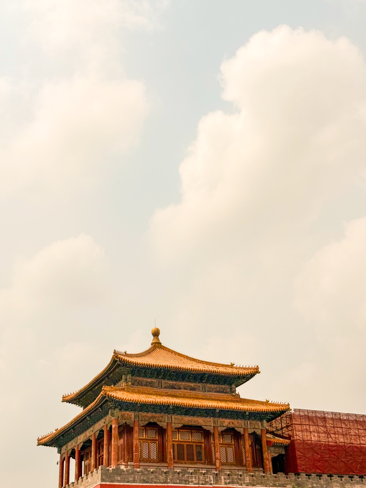 An ornate Beijing roof against a bright sky