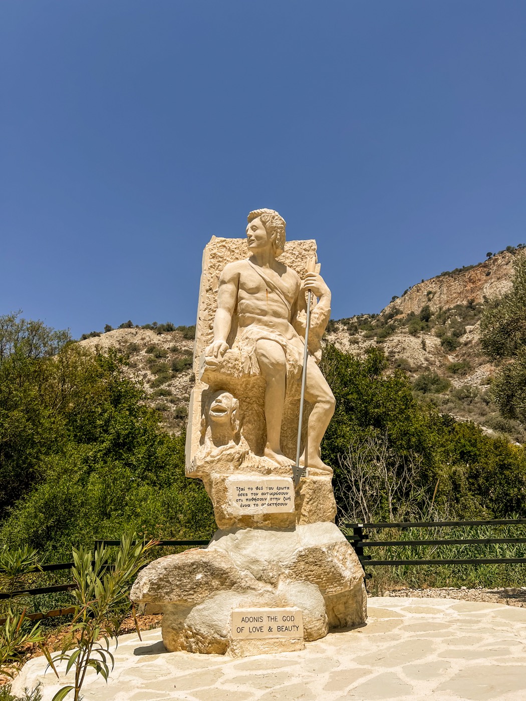 Stone statue of Adonis in the Cyprus landscape