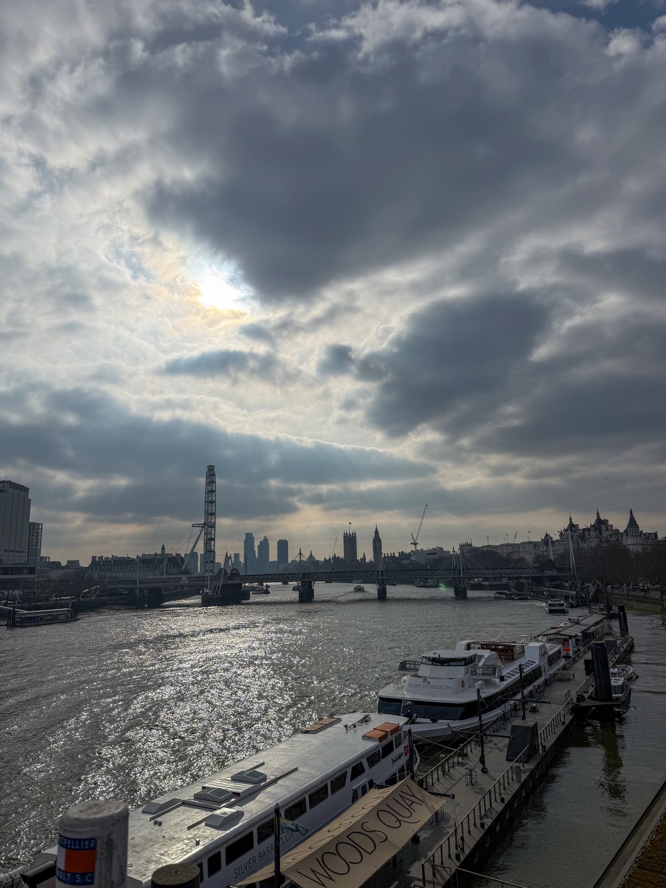 The Thames, London Eye and Westminster beneath dramatic clouds