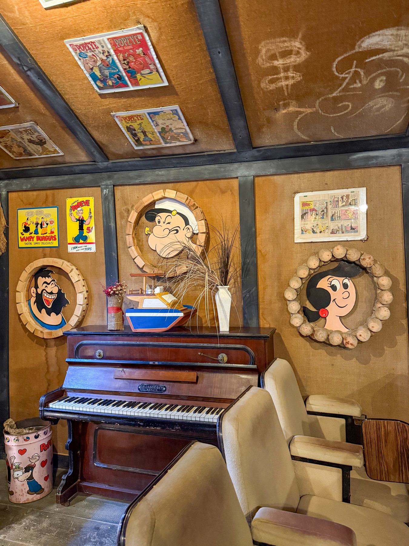 Piano surrounded by vintage Popeye illustrations