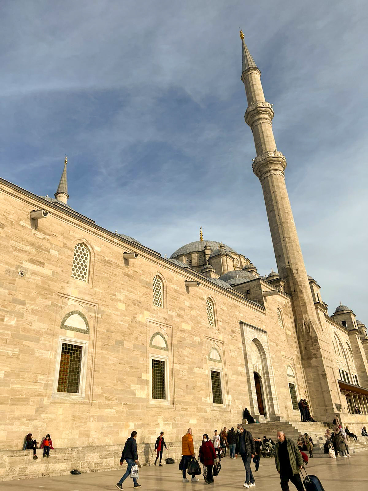 Sunlit mosque and tall minaret