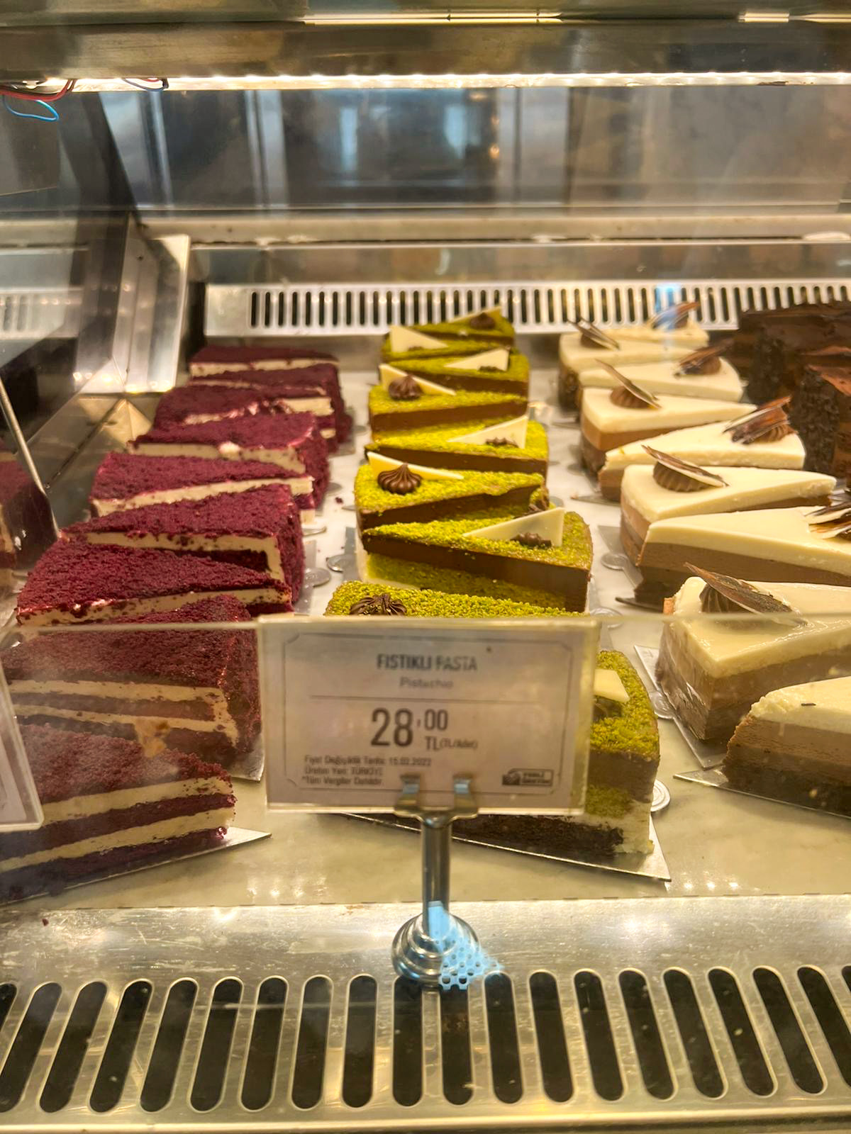 Cakes in a patisserie display